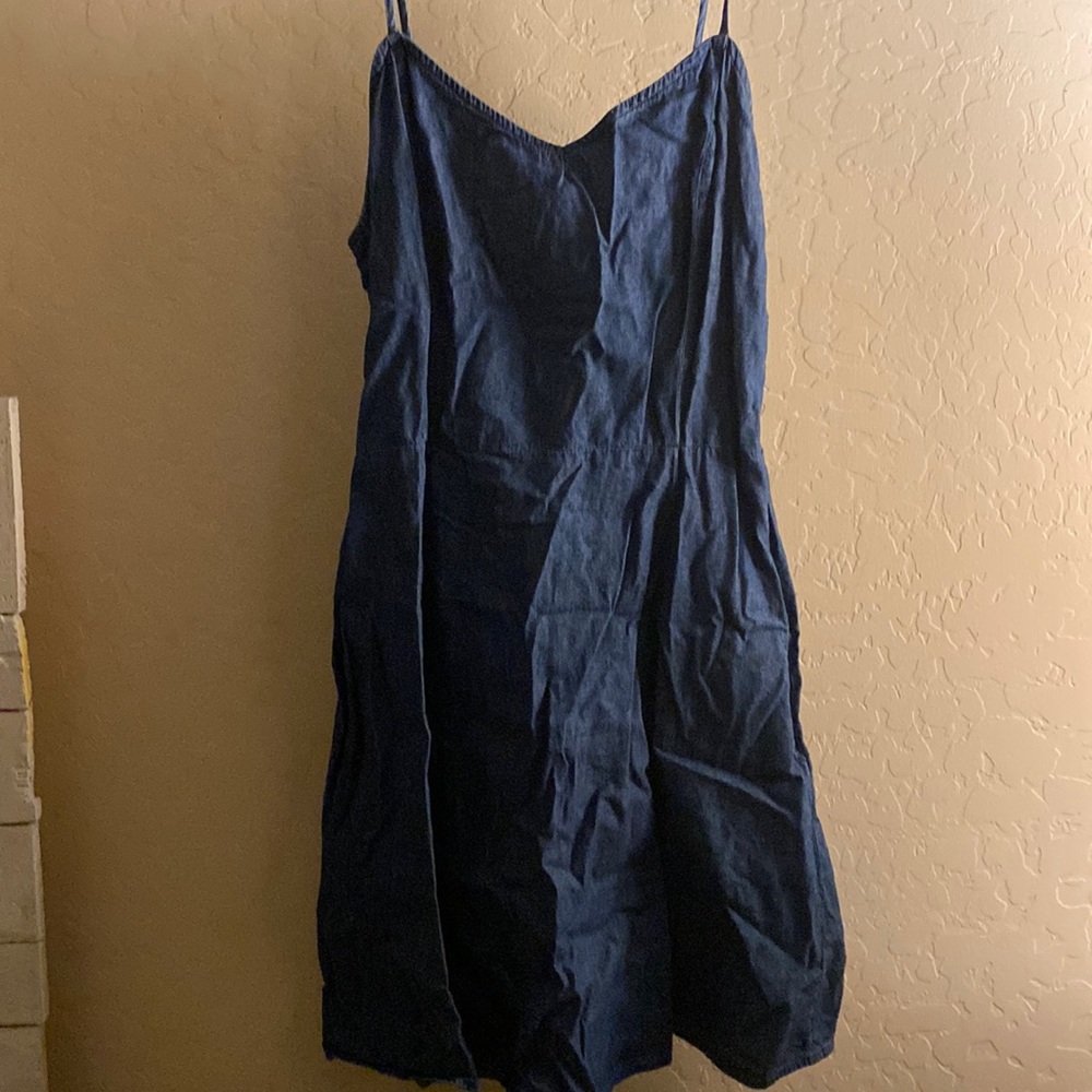 Jean material. Medium, blue, in good condition barley worn.